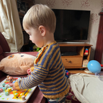 Claire's child playing with toys at home