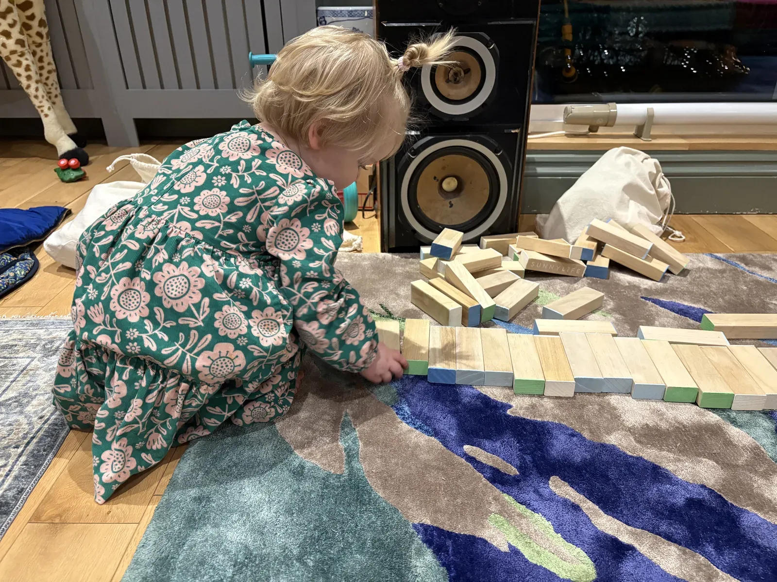 Julia and Vadim's toddler playing with wooden building blocks
