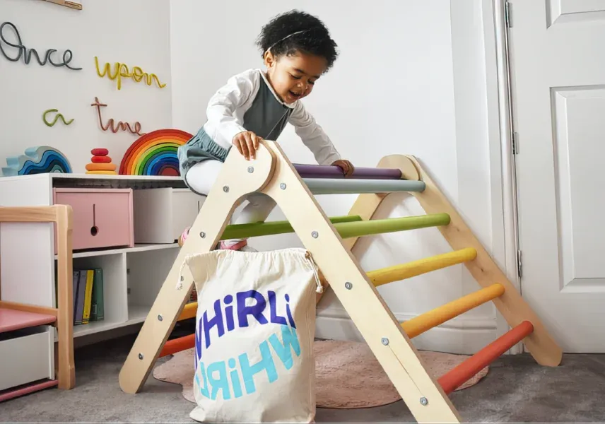 Child on climbing frame with Whirli bag